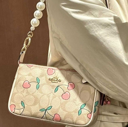 COACH FLORAL SLING BAGS