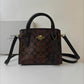 COACH ANDREA CARRYALL