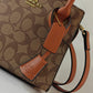 COACH ANDREA CARRYALL