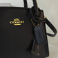 COACH ANDREA CARRYALL