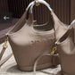 PRADA EMBOSSED LOGO BUCKET BAG