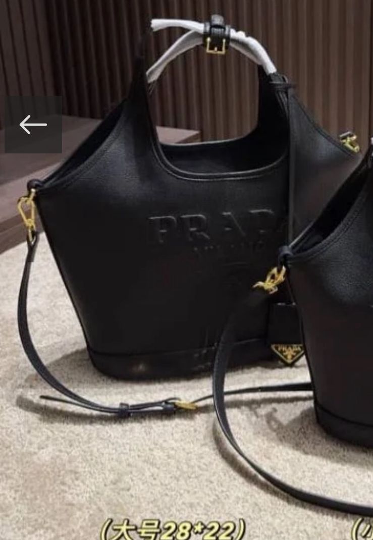 PRADA EMBOSSED LOGO BUCKET BAG