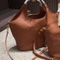 PRADA EMBOSSED LOGO BUCKET BAG