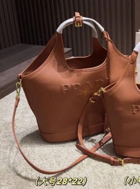PRADA EMBOSSED LOGO BUCKET BAG