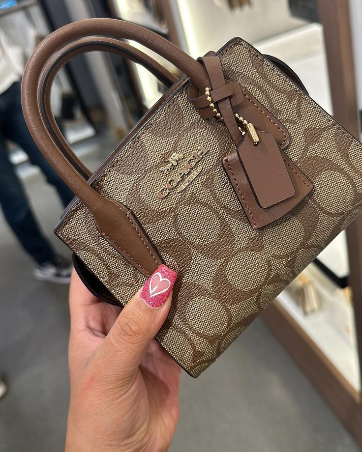 Coach Andrea Carryall