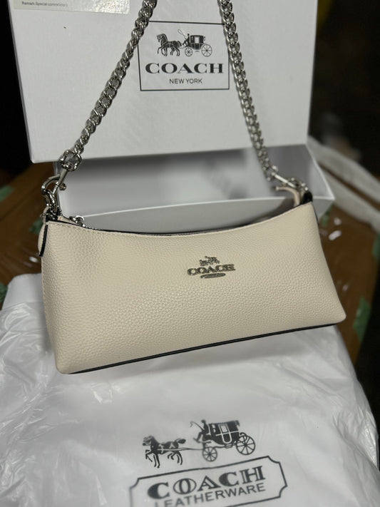 COACH CHARLOTTE HAND SLING BAG